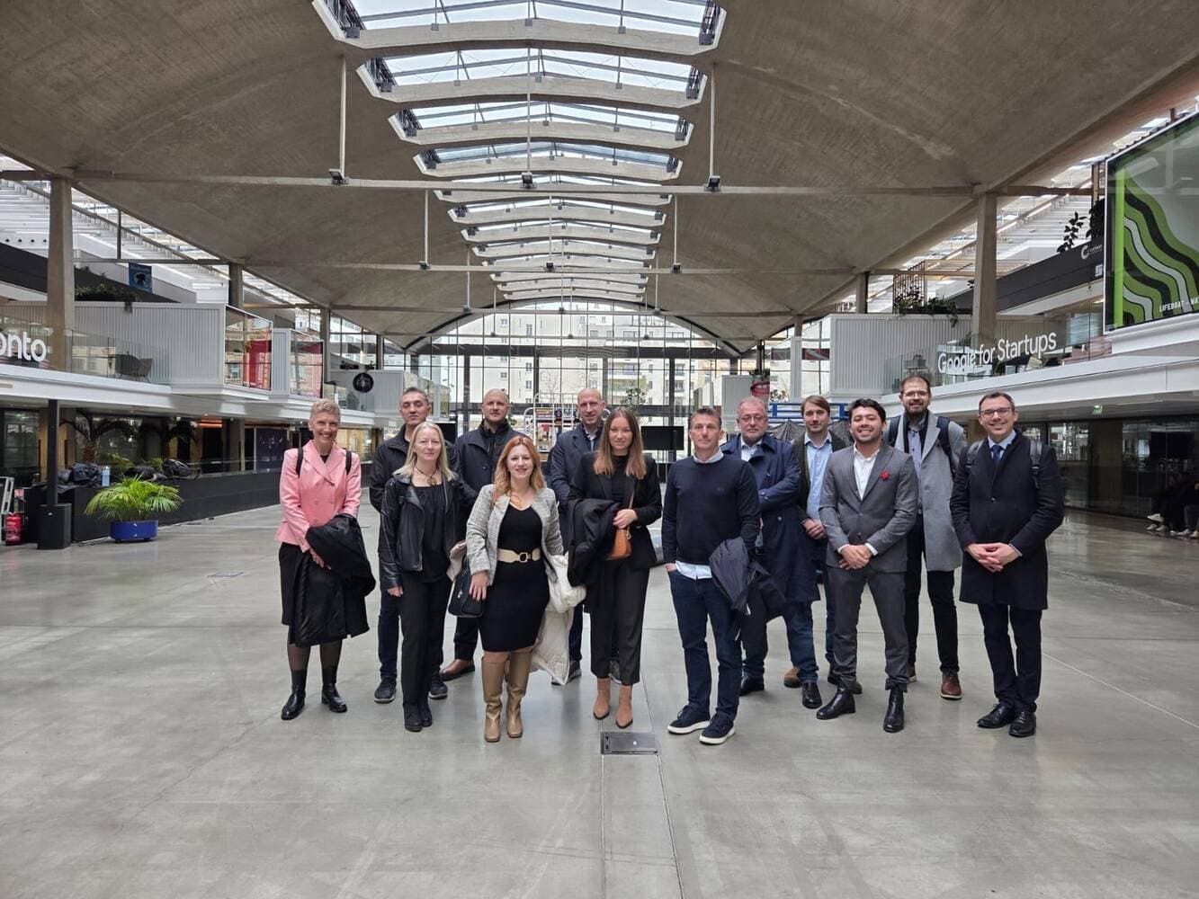 Full delegation group photo at Station F
