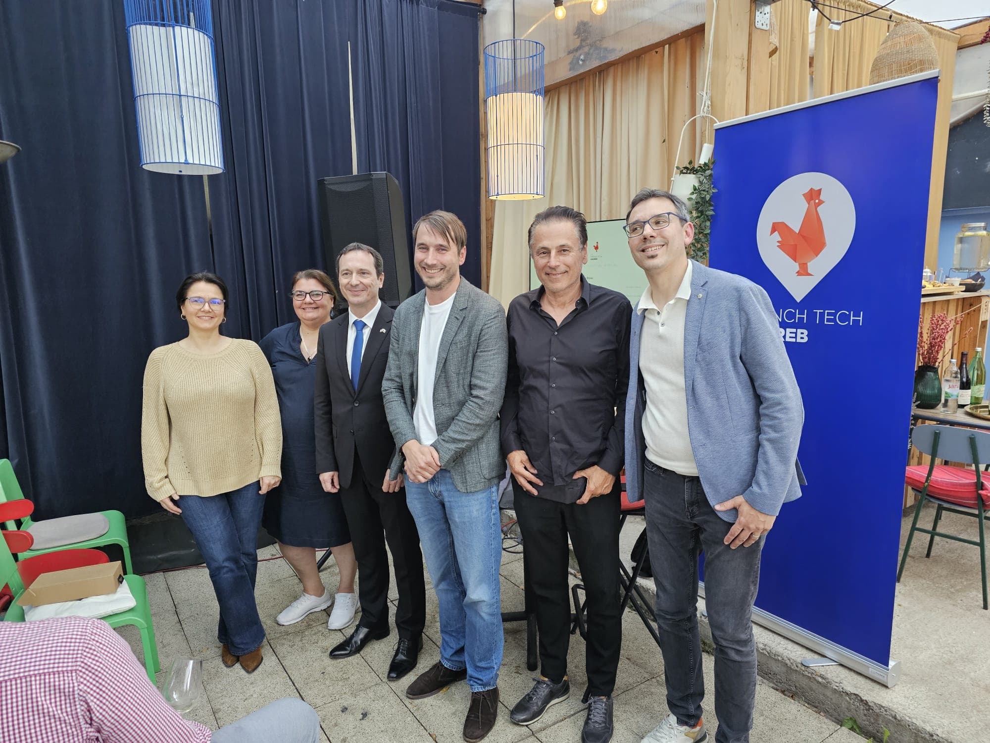 Group photo — speakers and organizers with French Tech Zagreb banner